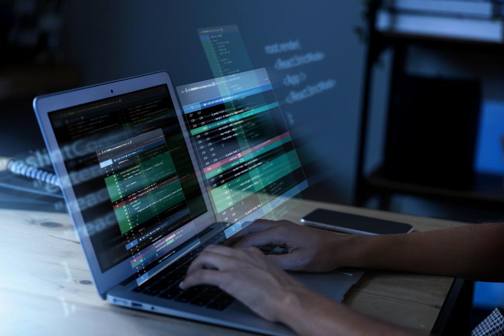 programming-background-with-person-working-with-codes-computer.jpg